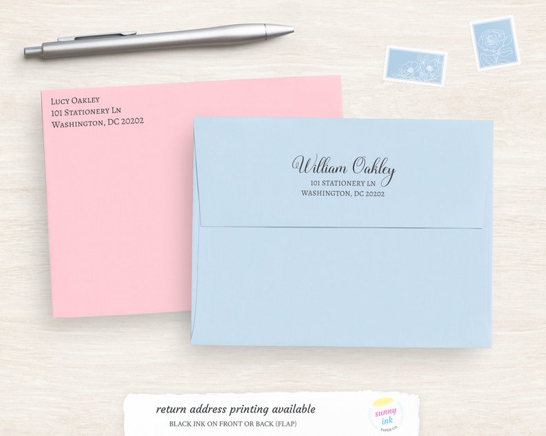 May include: Two envelopes, one pink and one light blue, with return addresses printed on them. The pink envelope has the name Lucy Oakley and the address 101 Stationery Ln, Washington, DC 20202. The light blue envelope has the name William Oakley and the address 101 Stationery Ln, Washington, DC 20202. Below the envelopes is a text box that says "return address printing available" and "Black ink on front or back (flap)".