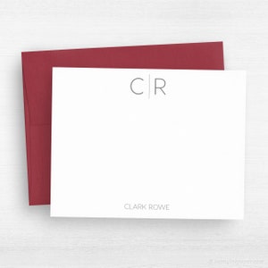 May include: White stationery card with a gray monogram "C|R" and the text "CLARK ROWE" at the bottom. The card is accompanied by a burgundy envelope.