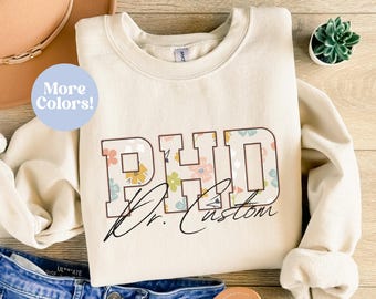 Personalized Phd Sweatshirt, Custom Doctor Crewneck Sweatshirt, Floral PhD Sweater, Ph.D. graduation Gift, Custom Doctoral Gift For Her