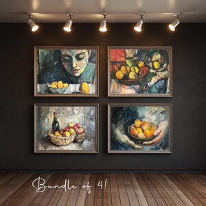 May include: Four framed oil paintings with still life themes. Each painting features fruit in bowls or baskets, with a dark background and wooden frames. The paintings are lit by spotlights.