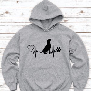 May include: Gray hooded sweatshirt with a black silhouette of a dog, a heart, a paw print, and a heartbeat line graphic.