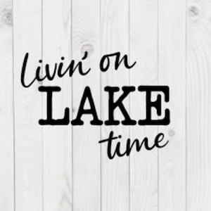 May include: White wooden background with the phrase "Livin' on LAKE time" in black script and block letters. The text is centered and the background has a vertical wood grain pattern.