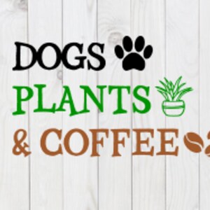 May include: A white wooden sign with the text "DOGS PLANTS & COFFEE" in black, green, and brown lettering. A black paw print is to the right of the word "DOGS" and a green potted plant is to the right of the word "PLANTS". Two brown coffee beans are to the right of the word "COFFEE".