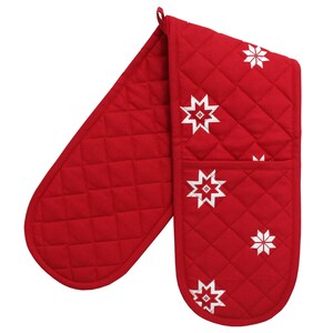 May include: Red quilted oven mitts with a white snowflake design.