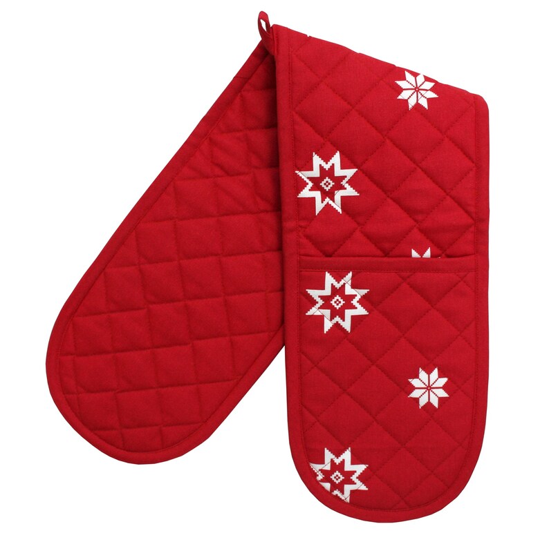 May include: Red quilted oven mitts with a white snowflake design.