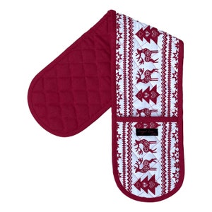 May include: A quilted, double oven mitt in a festive Christmas theme. The mitt is primarily burgundy with a white patterned section featuring reindeer and Christmas trees. The brand name "Ragged Rose" is printed on a small label.