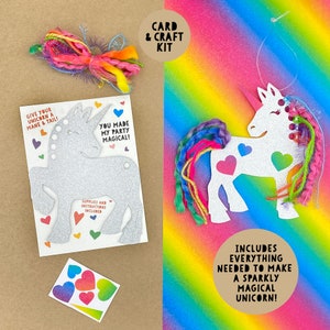 May include: A craft kit to make a sparkly unicorn. The kit includes a silver glitter unicorn cutout, colorful yarn for the mane and tail, and heart-shaped stickers. The text on the card reads "Give your unicorn a mane & tail! You made my party magical! Supplies and instructions included."