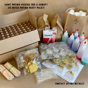 May include: A collection of potion-making supplies, including small glass bottles, glitter, stir sticks, and a box of vials. The image also shows a box of Sharpie markers, paper bags, and a sign that says "WANT POTION MAKING FOR A GROUP? WE OFFER POTION PARTY PACKS! CONTACT US FOR DETAILS!"