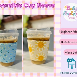 May include: Two clear plastic cups filled with coffee, each wrapped in a reversible cup sleeve. One sleeve is light blue with small white and blue floral patterns. The other is cream-colored with yellow sun designs. Text on the image reads "Reversible Cup Sleeve".