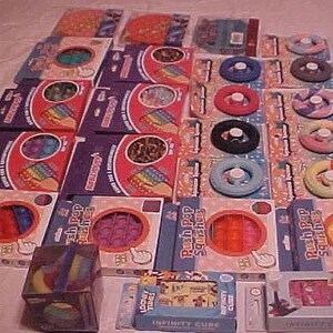 E#  25 Packages FIDGET SENSORY TOYS Stress Childl/Adult Variety. Original Packages. Great for also Resale, School, Day care, Home, Any Where