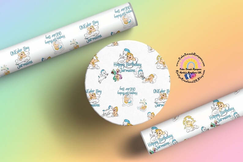 May include: White wrapping paper and a round cake topper with a repeating pattern of cartoon babies on clouds. The text "ONEder Boy Jarmaine" and "Happy Birthday Jarmaine" are visible. The background is a gradient of pastel colors.