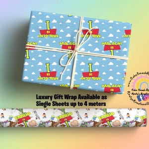 May include: Blue and white gift wrap with a repeating pattern of clouds and red signs that say "Malachi is 1". A roll of gift wrap with a white background and a repeating pattern of cartoon characters and the text "Emilio is 1" is also shown.