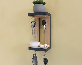 Small shelf with magnets and hooks for keys