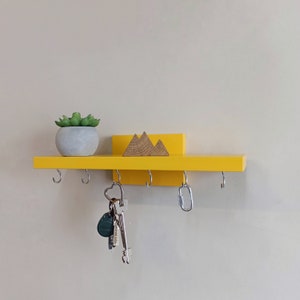 Wall shelf with hooks for keys