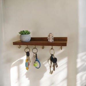 Oiginal wooden entryway shelf with hooksfor keys