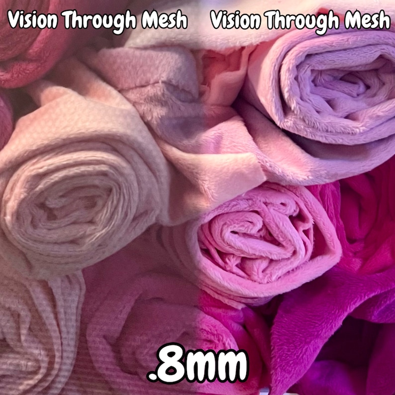 May include: Close-up of a pile of pink and purple fabric rolls. The fabric is soft and plush, with a slight sheen. The rolls are labeled "Vision Through Mesh" and the text ".8mm" is visible in the bottom center of the image.