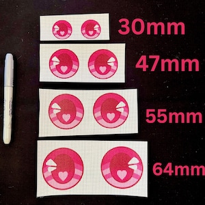May include: Four pairs of pink and white fabric eye patches with a heart design. The patches are 30mm, 47mm, 55mm, and 64mm in size.