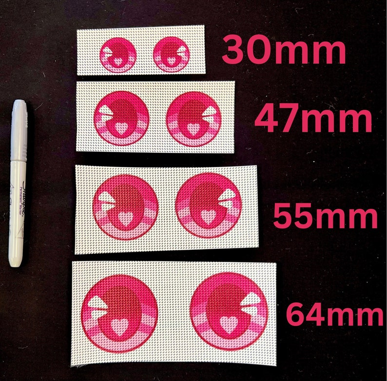 May include: Four pairs of pink and white fabric eye patches with a heart design. The patches are 30mm, 47mm, 55mm, and 64mm in size.