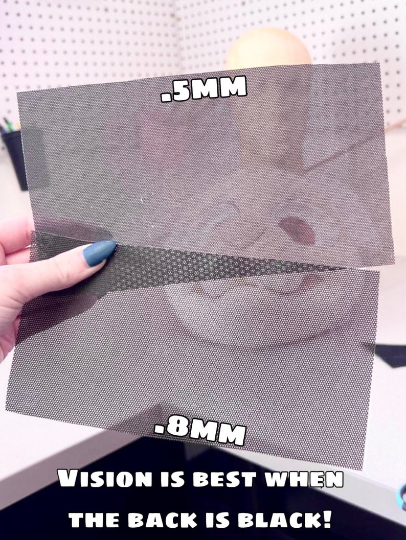 May include: Two pieces of black mesh fabric, one with a 0.5 mm weave and the other with a 0.8 mm weave. The text "VISION IS BEST WHEN THE BACK IS BLACK!" is printed below the fabric.
