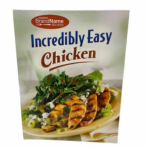 May include: A cookbook titled "Incredibly Easy Chicken" featuring a photo of a salad with grilled chicken, greens, and blue cheese.