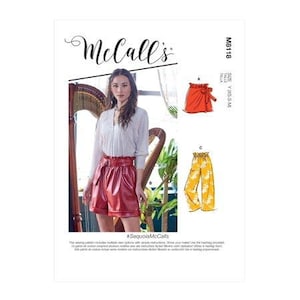 May include: Sewing pattern McCall's M8118 for a pair of shorts and pants. The pattern includes multiple view options with simple instructions. The model is wearing a white blouse, red leather shorts, and a brown belt. The pattern is available in sizes XS-S-M-L.
