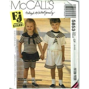 May include: A sewing pattern for a sailor-themed outfit for a child. The pattern is for sizes 4, 5, and 6. The pattern is from McCall's and features the Gitano brand. The pattern includes instructions for overlock (serger) sewing.