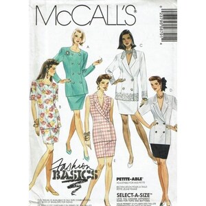 May include: McCall's sewing pattern featuring various women's suit designs. The pattern includes a double-breasted teal suit, a floral print skirt suit, a white suit with lace trim, and a plaid suit. The text "Fashion Basics" is visible.