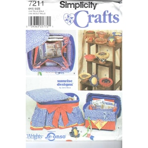 May include: Simplicity Crafts sewing pattern featuring a blue and red fabric storage box with a bow, and various craft projects. The pattern includes instructions for making a sewing box, pincushions, and other craft items. The pattern is labeled "7211".