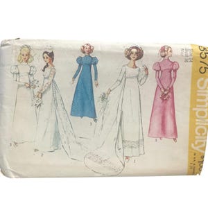 May include: A Simplicity sewing pattern envelope for a floor-length dress with puff sleeves, labeled size 14 and bust 36. The illustration displays five variations of the dress in white, blue, and pink, featuring different sleeve lengths and trains.