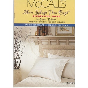 May include: A white fabric headboard with a decorative design and a white pillow with lace trim. The headboard is on a bed with a white bedspread. The image is from a McCall's magazine article titled "More Splash Than Cash" by Donna Babylon.