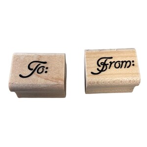 May include: Two wooden stamps with the words "To:" and "From:" in a cursive font.