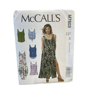 May include: A McCall's sewing pattern envelope, M7603, showing illustrations of tops and a long dress with a side slit. The dress has a tropical leaf print. The size is A5 (6-8-10-12-14).