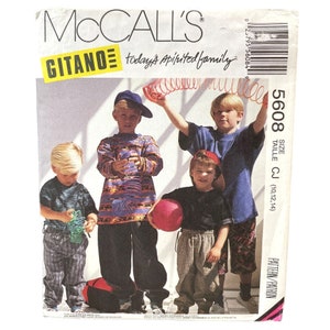 May include: A McCall's sewing pattern for boys' clothing, featuring four boys wearing casual outfits. The pattern number is 5608 and the size is CJ (10, 12, 14). The pattern is titled "Gitano: Today's Spirited Family."