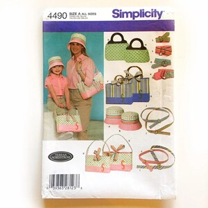 May include: Simplicity sewing pattern 4490 showing various bags, hats, and accessories. The pattern includes images of a woman and child wearing matching outfits with pink and green polka dot and striped bags and hats. The pattern is designed by Teresa Nordstrom.