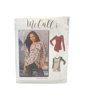 May include: A McCall's M7247 sewing pattern envelope for a long-sleeve top with a crossover front hem. The package displays the brand name, size E5 (14-16-18-20-22), and illustrations of two design variations, one in red and one in beige and black.