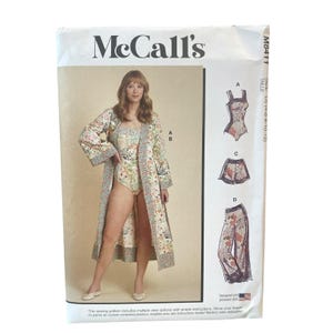 May include: McCall's M8411 sewing pattern envelope featuring a floral print bodysuit and matching long robe. The front displays illustrations of garment views A, C, and D, including a bodysuit, shorts, and wide-leg pants in sizes 4-6-8-10-12.