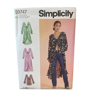 May include: Simplicity sewing pattern S9747, featuring three dress designs. The pattern envelope shows a woman wearing a floral print dress. Sizes 8-16 are included. The envelope has a white background with the Simplicity logo.