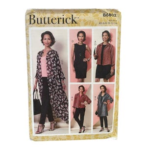 May include: Butterick sewing pattern B6802 size A5 (6-8-10-12-14) featuring illustrations of various clothing styles including a long floral duster, a sleeveless black dress, a red patterned jacket, a red jacket, and a grey coat over black pants.
