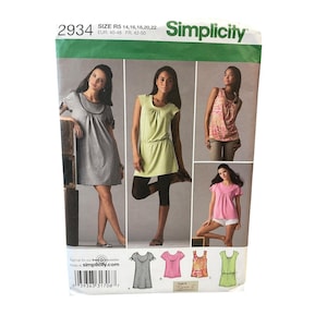 May include: Simplicity sewing pattern 2934, size R5 14-22, featuring four garment variations: a grey dress, a light green tunic with black leggings, a patterned sleeveless top with trousers, and a pink top with white shorts, all shown on the envelope.