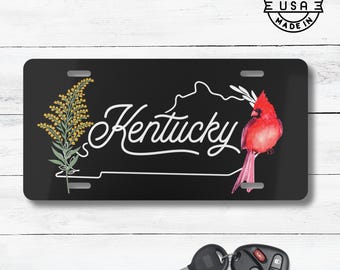 Placa de matrícula con el ave y la flor del estado de Kentucky / Placa de matrícula con el cardenal rojo y la vara de oro