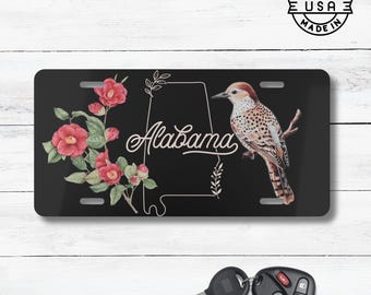 Placa de matrícula con el ave y la flor estatal de Alabama / Placa de matrícula con camelia y escribano amarillo