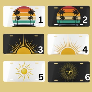 May include: Six different designs for license plates. The first two feature a sunset with palm trees and the numbers 1 and 2. The next two feature a yellow sun with rays and the numbers 3 and 4. The last two feature a sun with a face and the numbers 5 and 6.