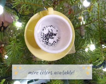 ominous teacup and saucer ornament