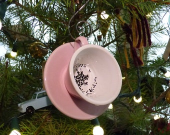 ominous teacup and saucer ornament