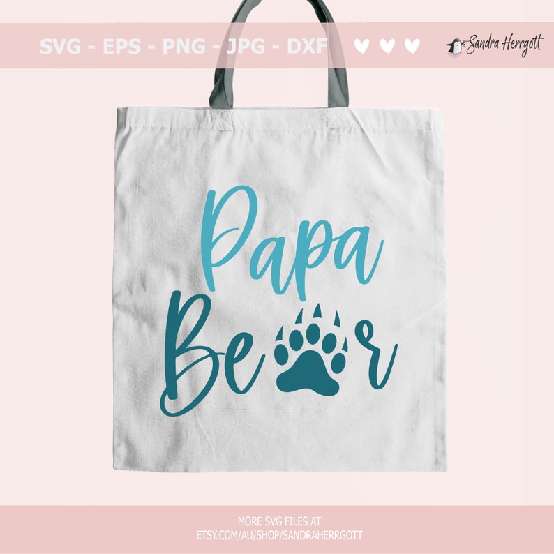 May include: A white tote bag with black handles features the words "Papa Bear" in teal script and a teal bear paw print. The top of the bag has the text "SVG - EPS - PNG - JPG - DXF". The bottom of the bag has the text "MORE SVG FILES AT ETSY.COM/AU/SHOP/SANDRAHERRGOTT".
