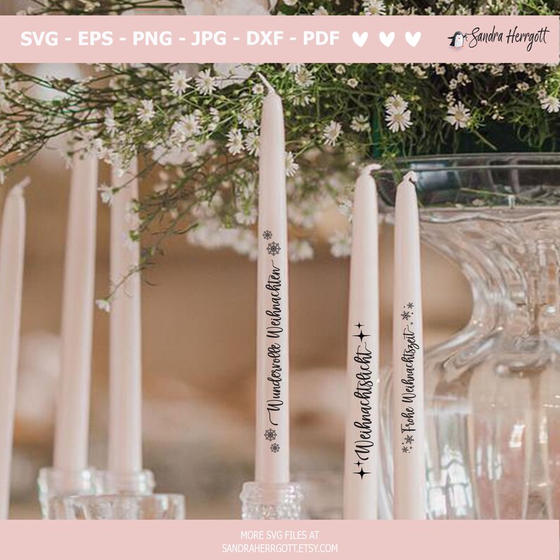 May include: Ivory taper candles with black text and snowflake designs. The candles have text that reads "Wundervolle Weihnachten", "Weihnachtslicht", and "Frohe Weihnachtszeit". The candles are displayed with white flowers and glass candle holders.