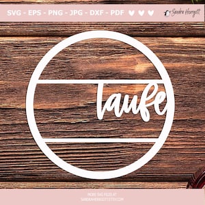 May include: White circle with the word "Laufe" written in a cursive font inside. The circle is on a brown wooden background.