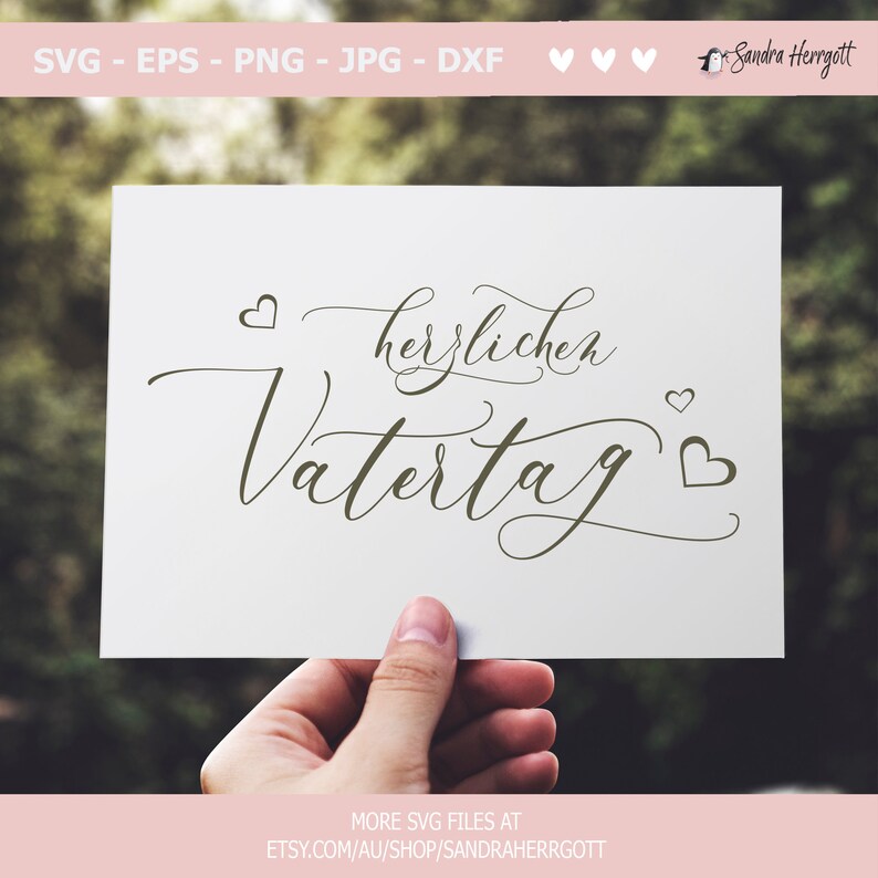 May include: A white card with the text "herzlichen Vatertag" written in cursive script with two small hearts on either side of the text.