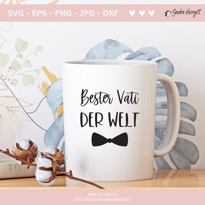 May include: White ceramic mug with a black bow tie and the text "Bester Vati DER WELT" in black.