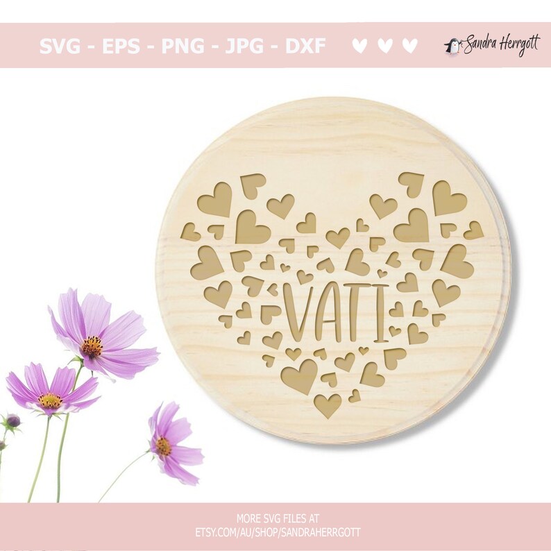 May include: A wooden circle with a heart shape made of small hearts and the word "VATI" inside. The circle is on a white background.